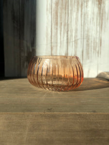 Oblong peach glass with small linear ridges